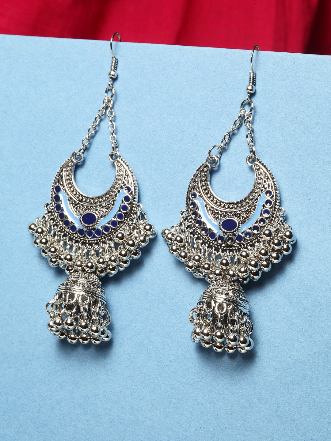

Shining Diva Fashion Silver-Toned Blue Oxidised Crescent Shaped Jhumkas