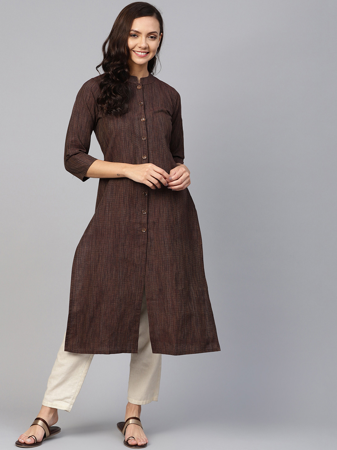

Jompers Women Coffee Brown & Off-White Solid Kurta with Trousers