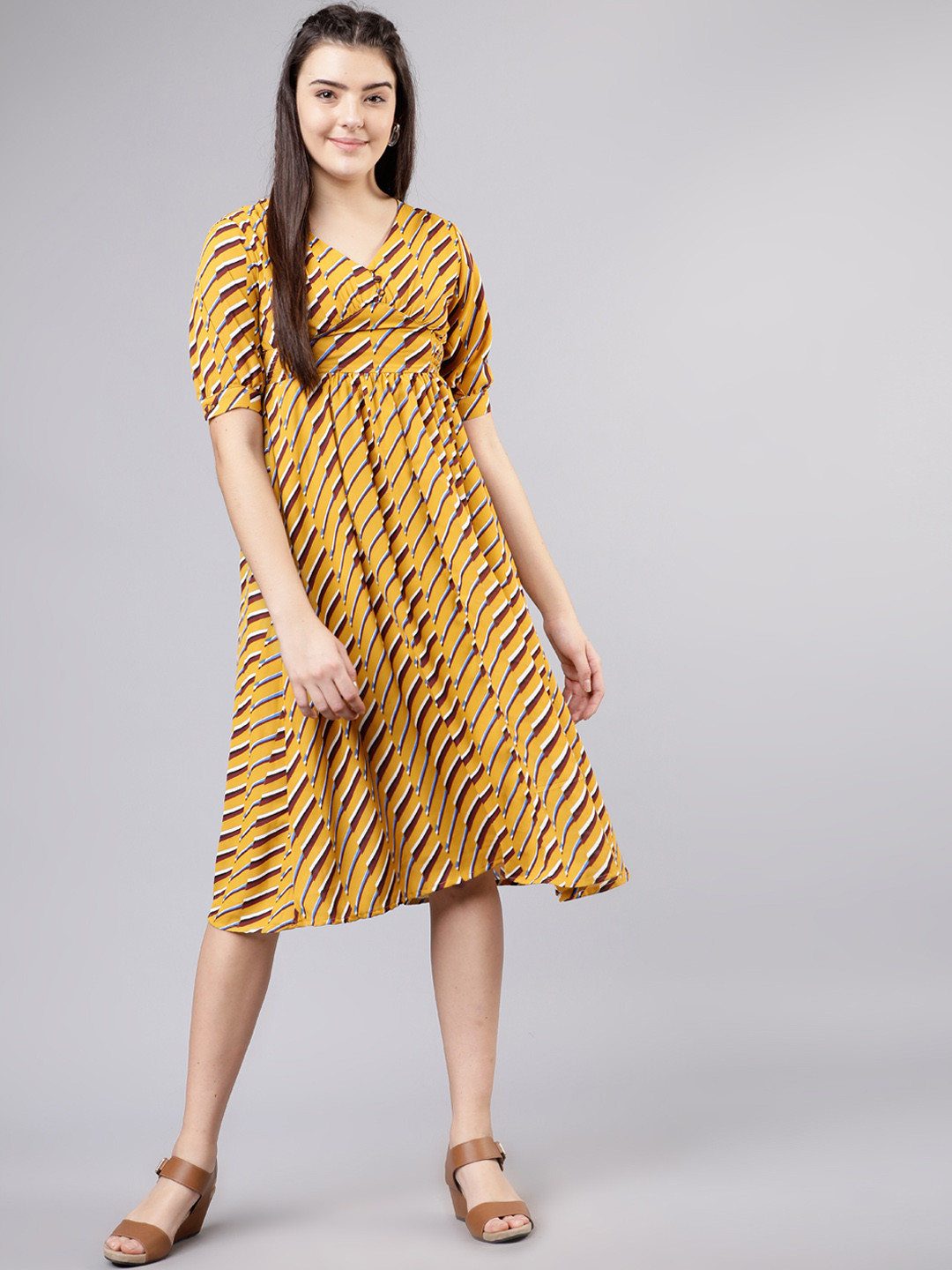 

Tokyo Talkies Women Printed Mustard Yellow Empire Dress