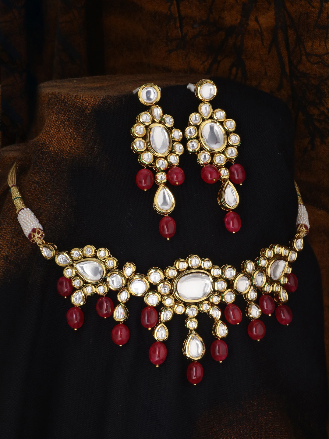 

Tistabene Gold-Plated White Kundan-Studded & Red Beaded Jewellery Set