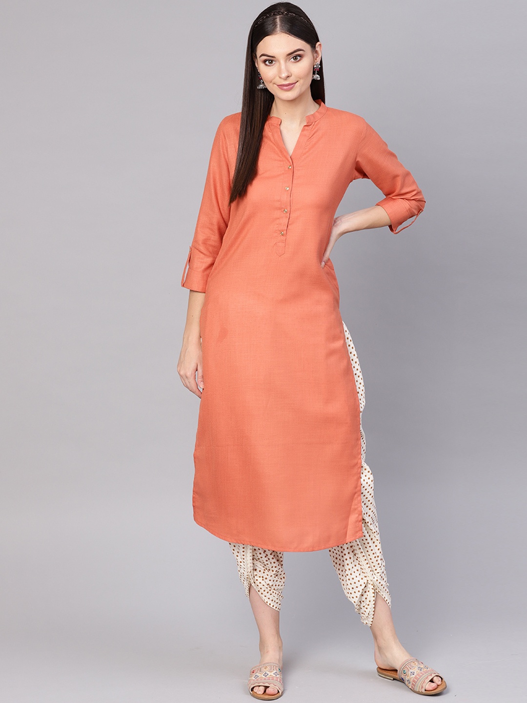 

Indo Era Women Rust Orange Solid Straight Kurta