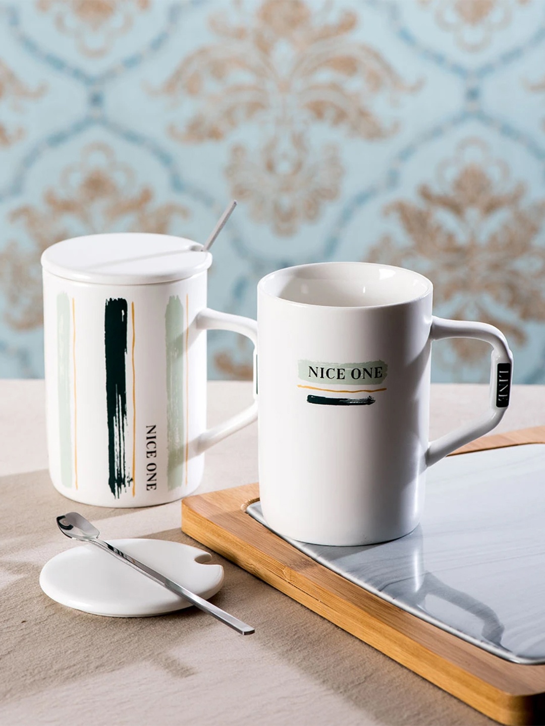

THEDECORKART Set of 2 White Printed Ceramic Coffee Mugs With Lids & Spoons