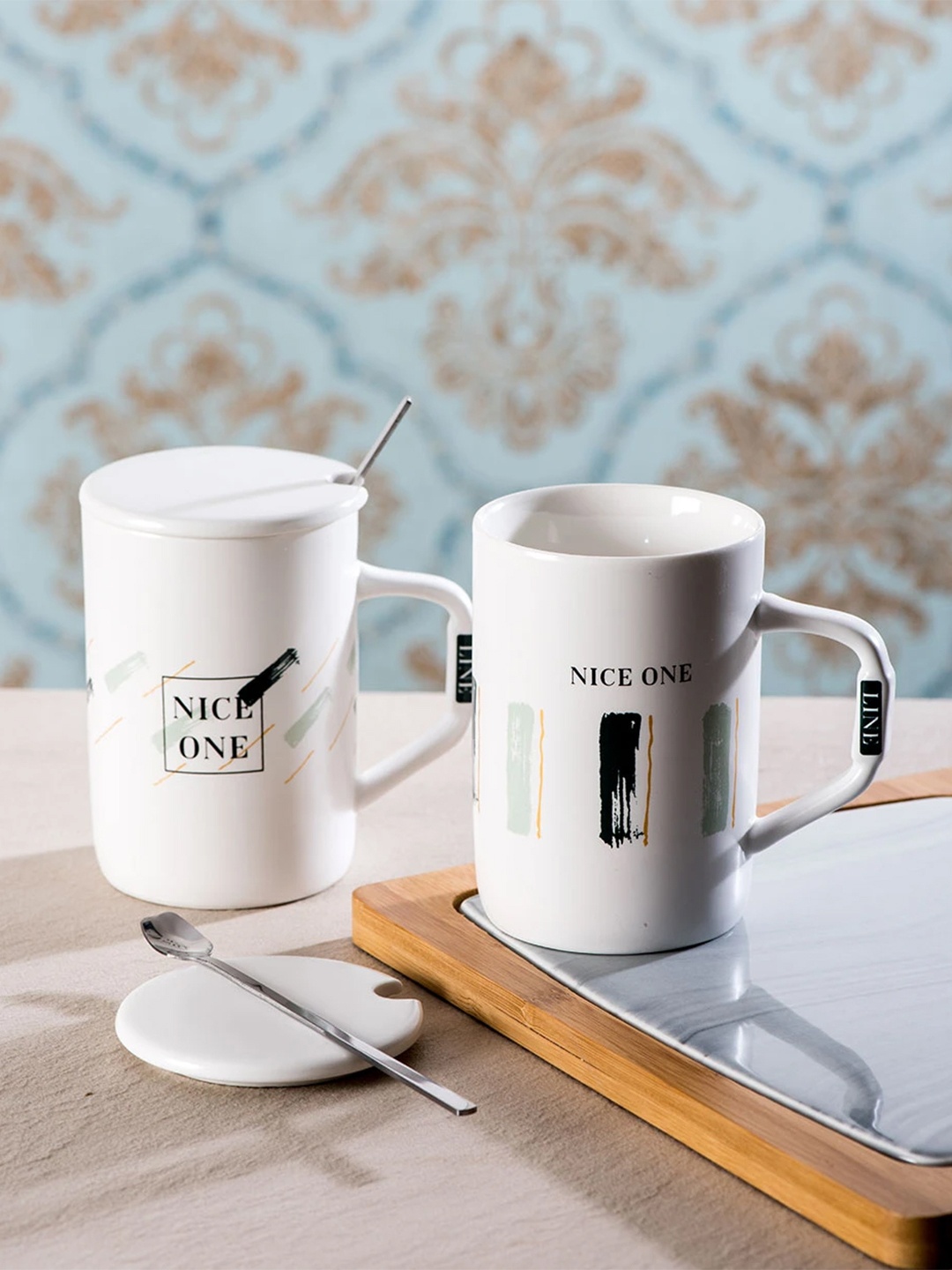 

THEDECORKART Set of 2 White Printed Coffee Mugs With Lids & Spoons