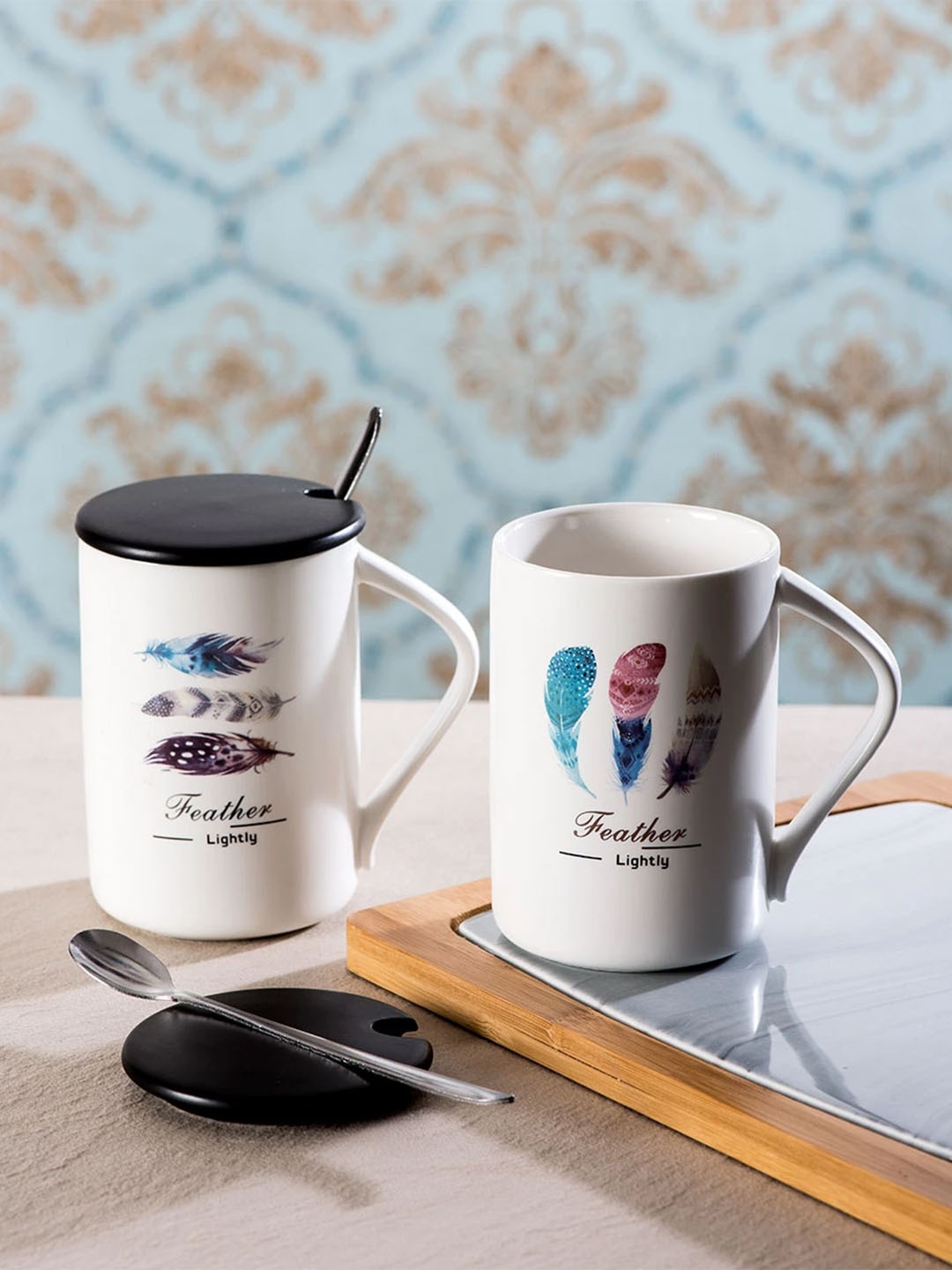 

THEDECORKART Set of 2 White Printed Ceramic Coffee Mugs With Lids & Spoons