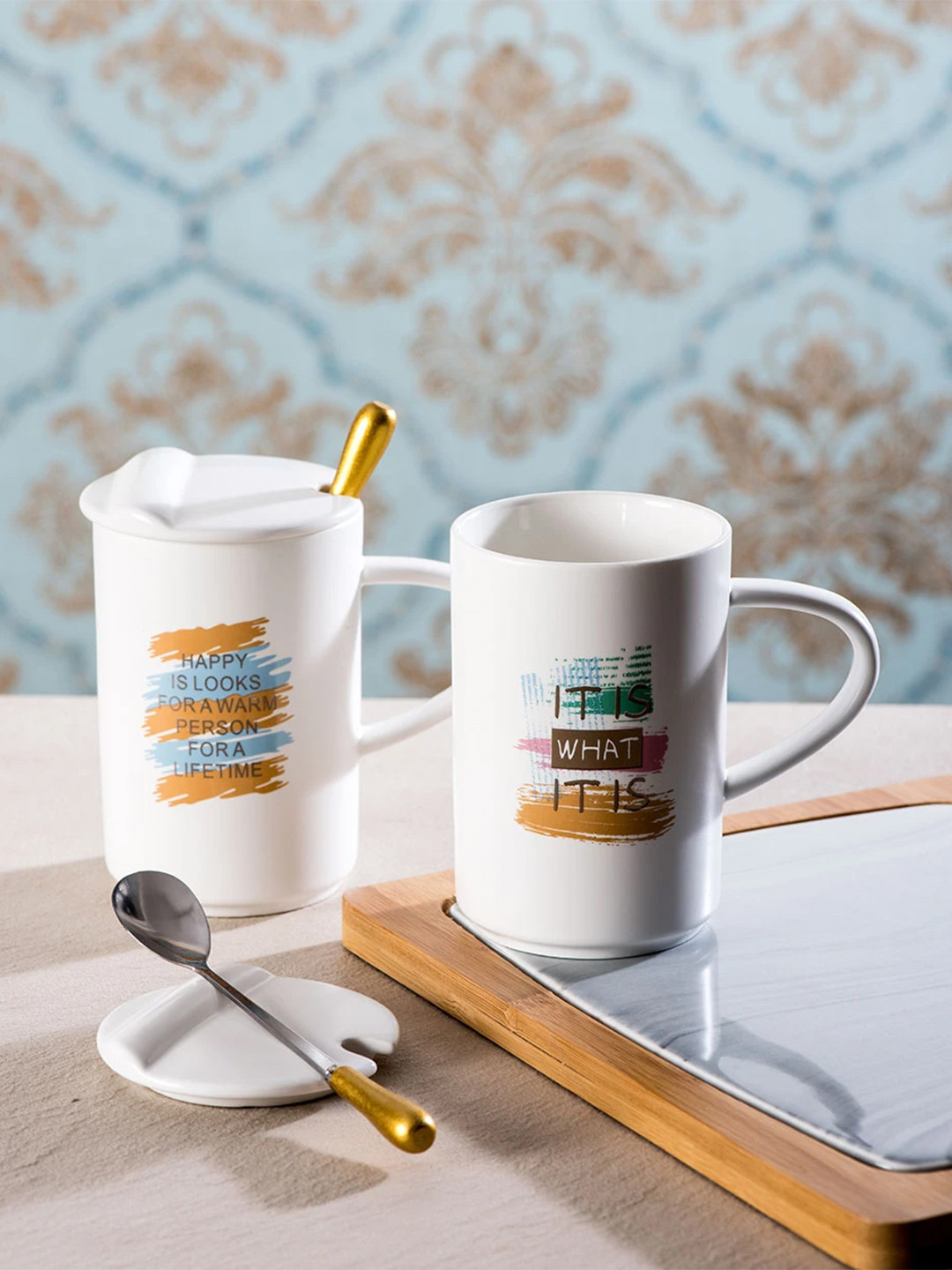 

THEDECORKART Set of 2 White Printed Ceramic Coffee Mugs With Lids & Spoons