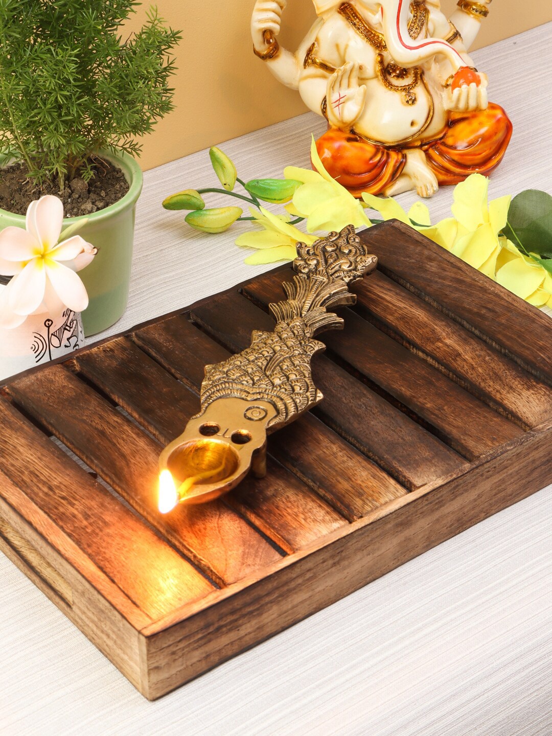 

Imli Street Gold-Toned Brass Pooja Spoon Shaped Diya