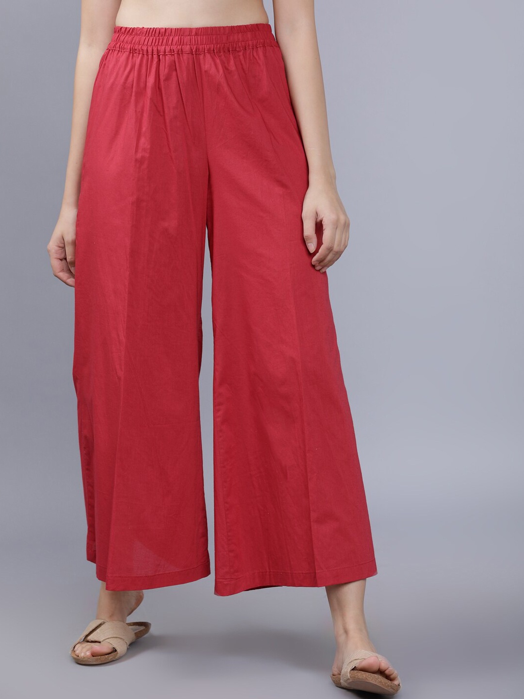 

Vishudh Women Red Solid Wide Fit Palazzos