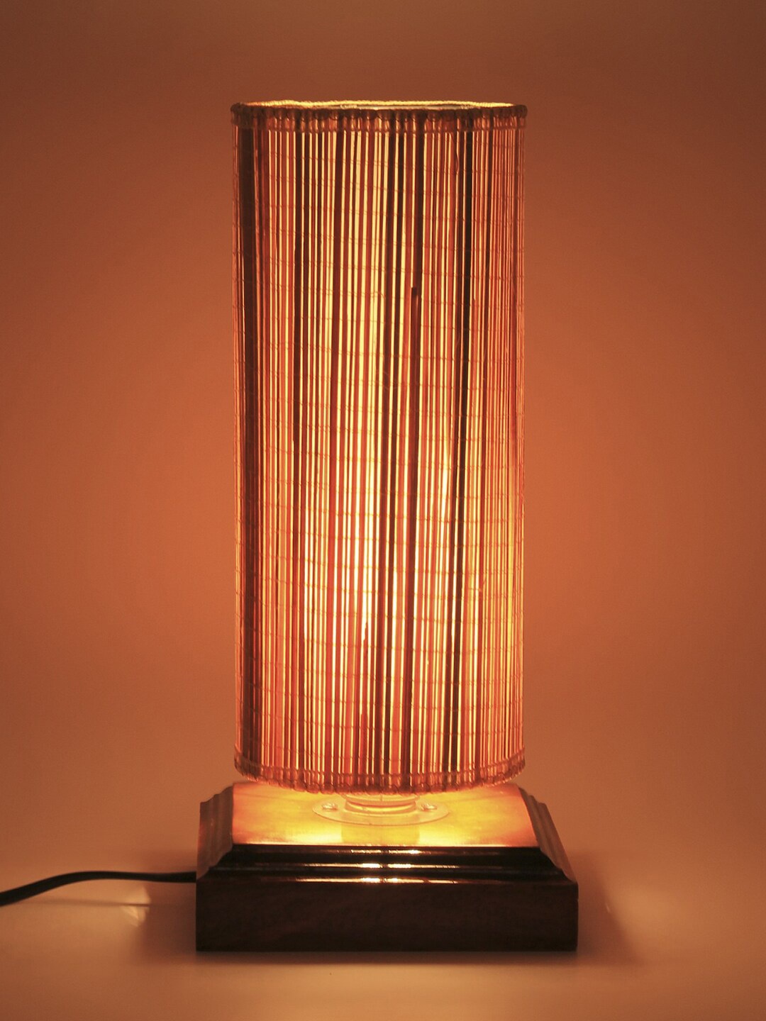 

Devansh Beige Solid Cylindrical Bamboo Column Lamp