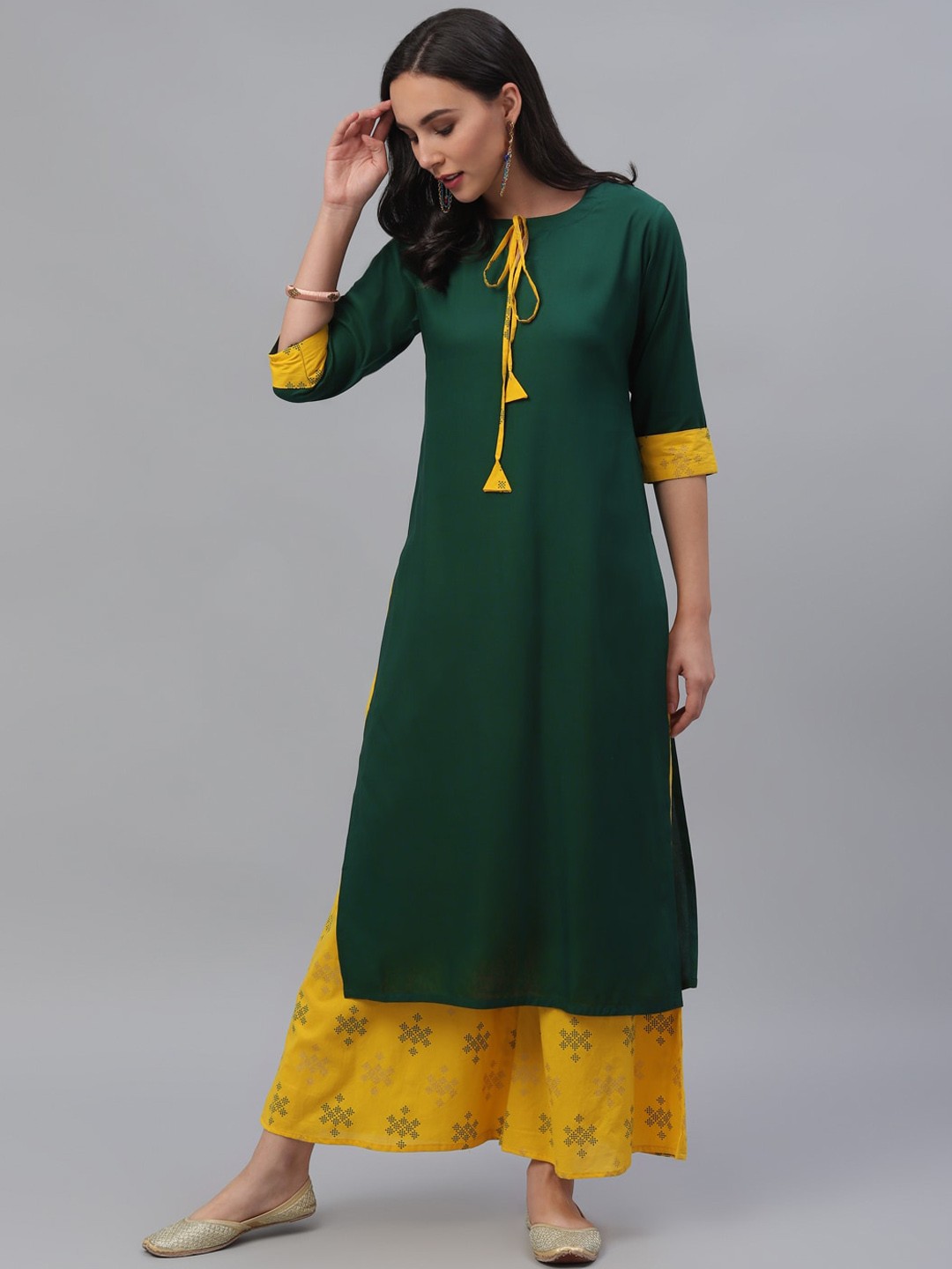 

Gerua By Libas Women Green Yellow Solid Kurta with Palazzos