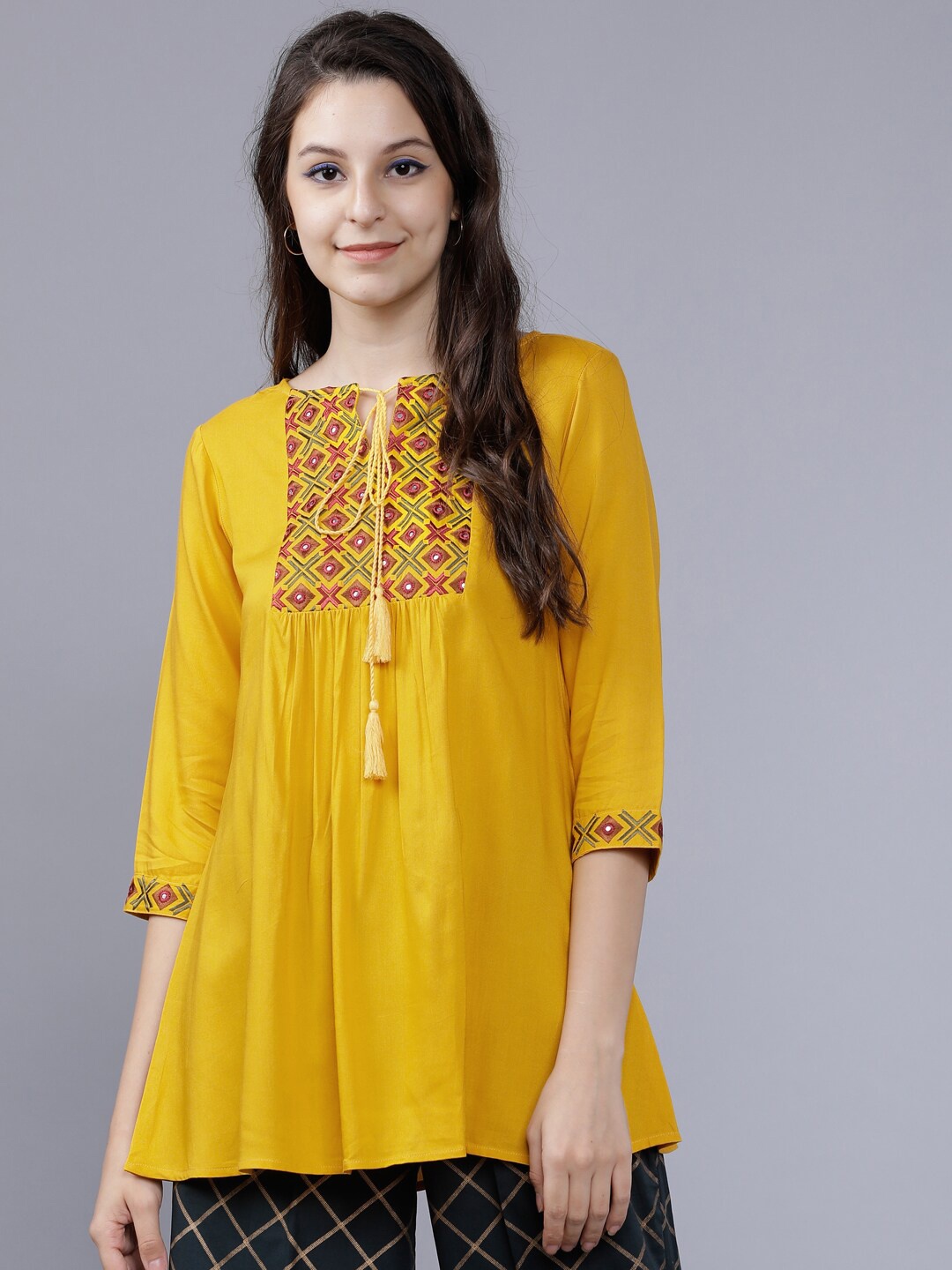 

Vishudh Women Yellow Embroidered A-Line Longline Top
