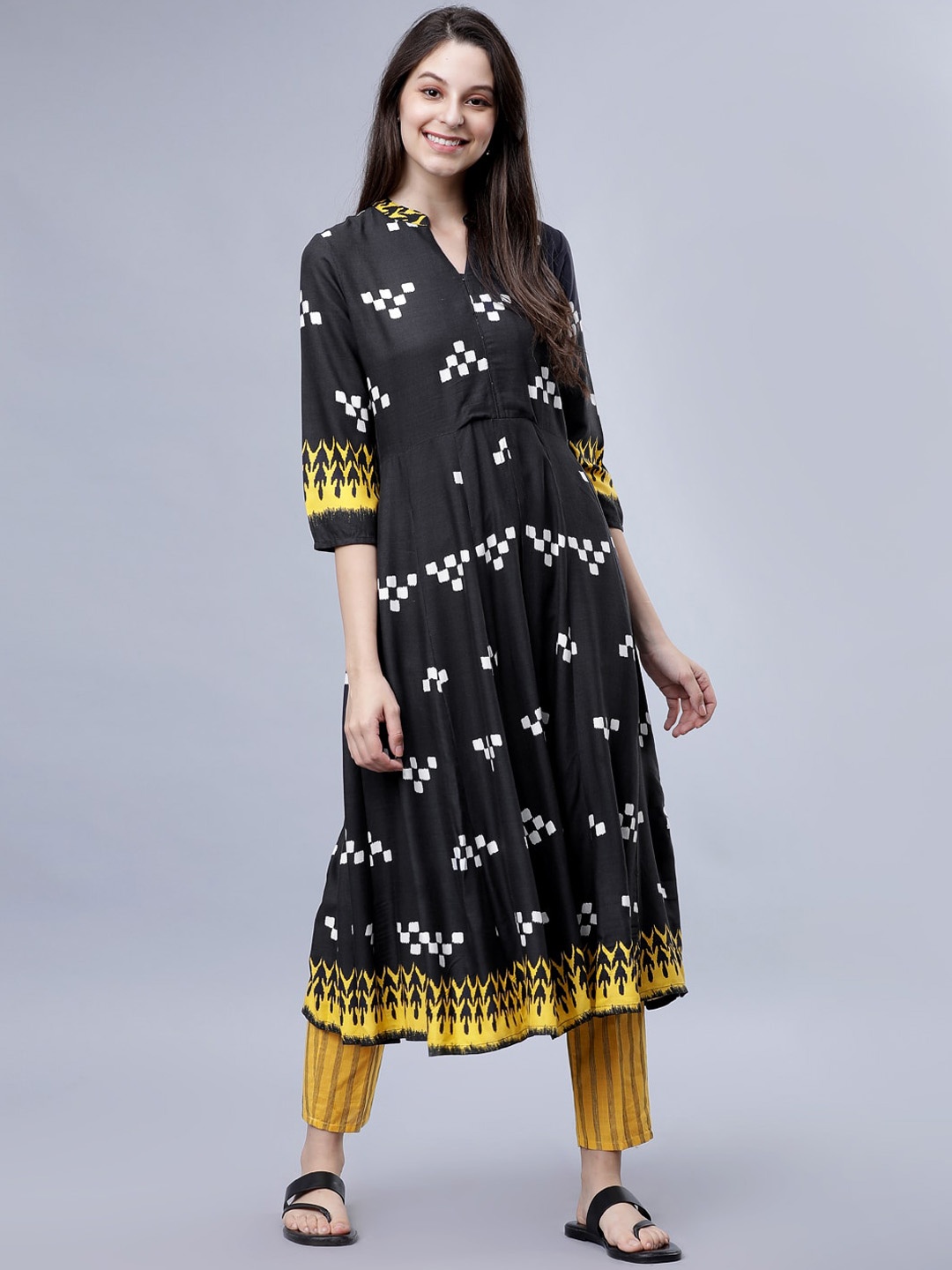 

Vishudh Women Black & Yellow Printed Kurta with Trousers
