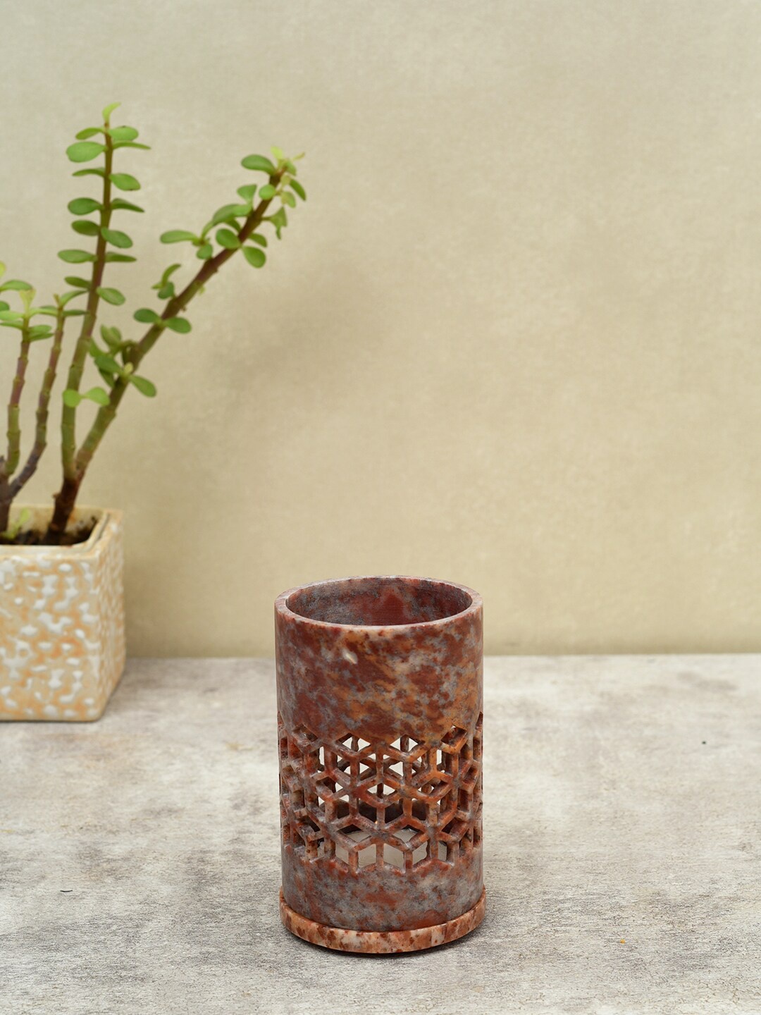 

Unravel India Handcarved Multicolored Tea Light Holder In Soap Stone, Brown
