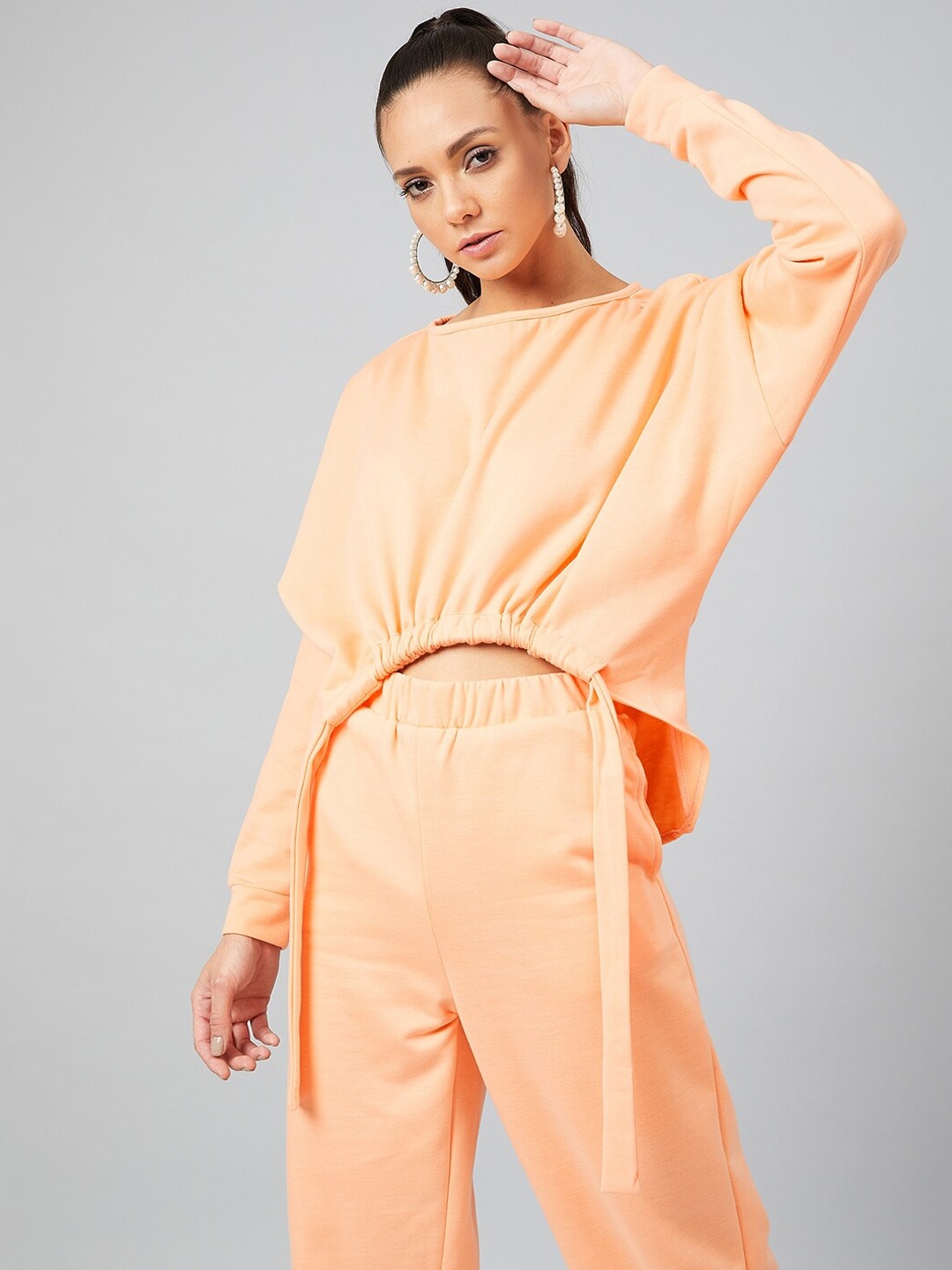 

Athena Women Peach-Coloured Solid Sweatshirt
