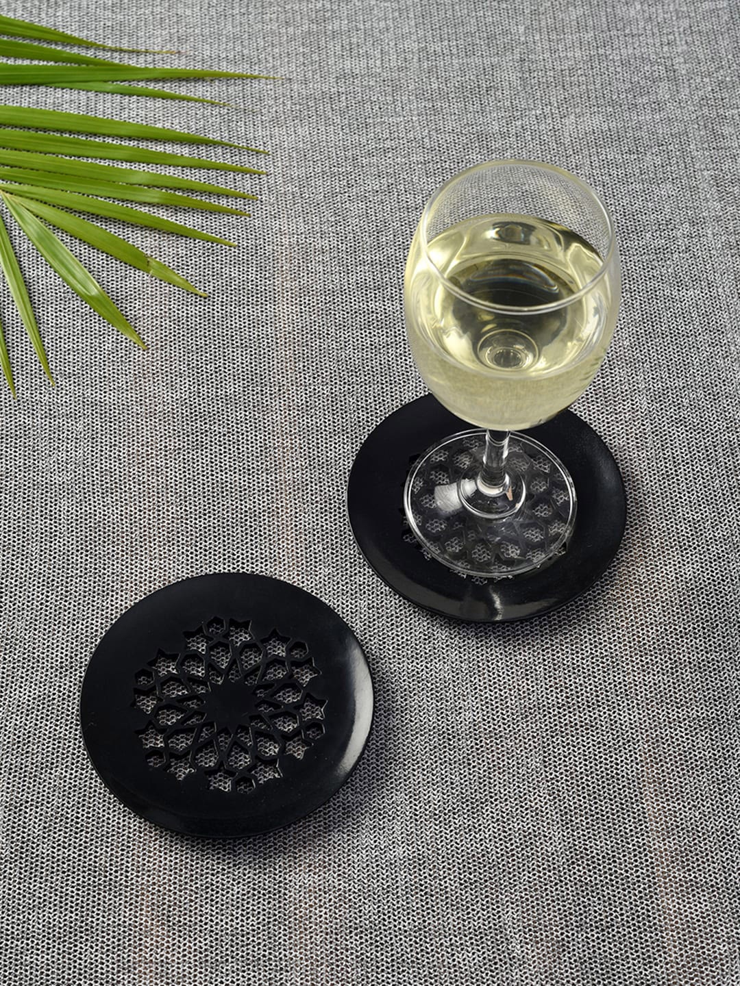 

Unravel India Set of 2 Black Handcarved Circular Coaster in Soap Stone
