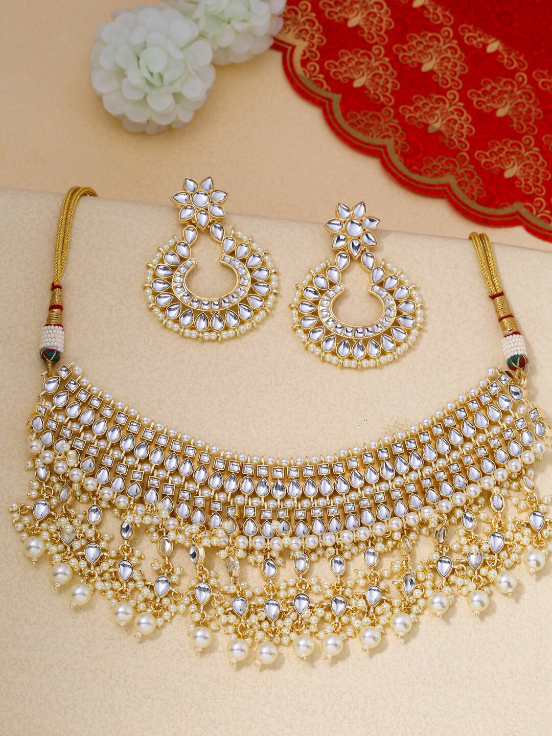 

Shoshaa Gold-Plated White Kundan-Studded Beaded Handcrafted Jewellery Set