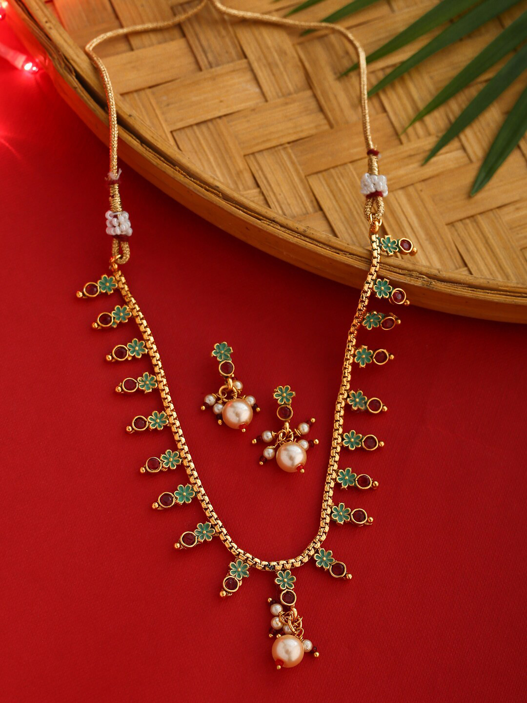 

Shoshaa Gold-Plated Red & Green Stone Studded Handcrafted Jewellery Set
