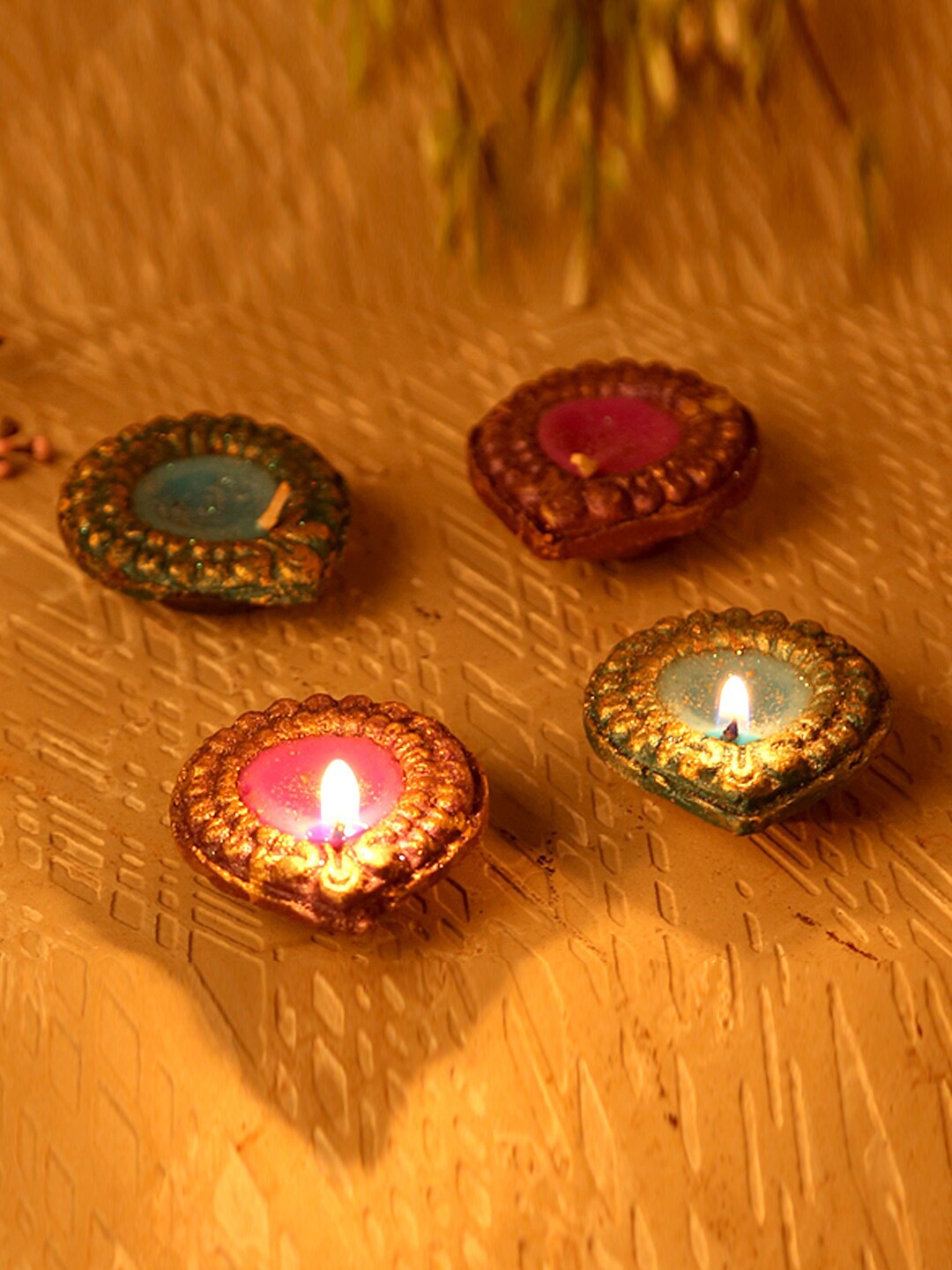 

Aapno Rajasthan Set Of 4 Handcrafted Wax Filled Terracotta Diyas, Purple