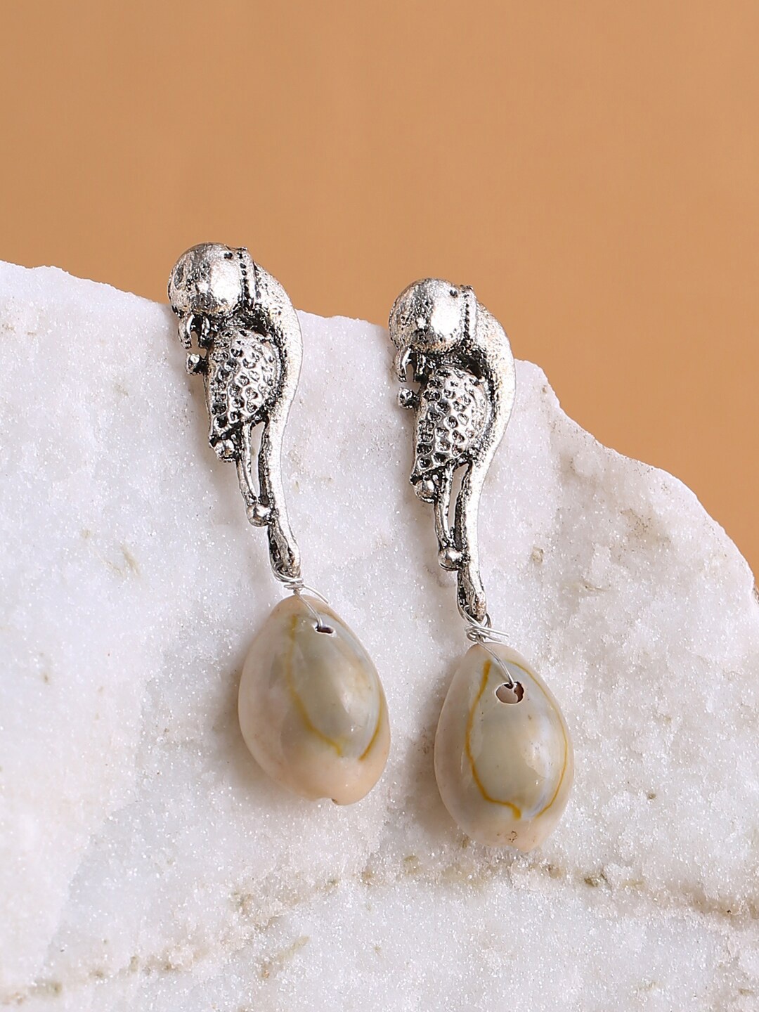 

Shoshaa White & Silver-Plated Oxidised Peacock Shaped Drop Earrings
