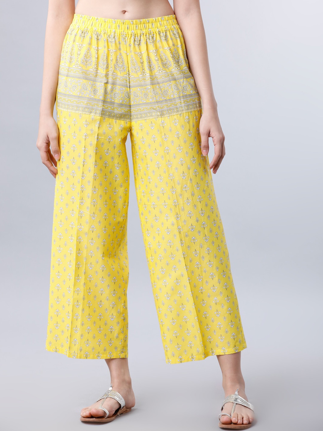 

Vishudh Women Yellow Printed Straight Palazzos