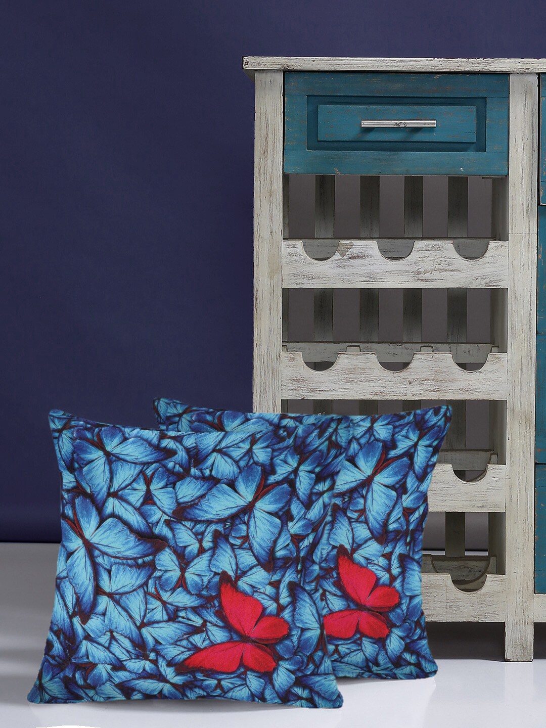 

Alina decor Set Of 2 Blue & Red Printed Square Cushion Covers