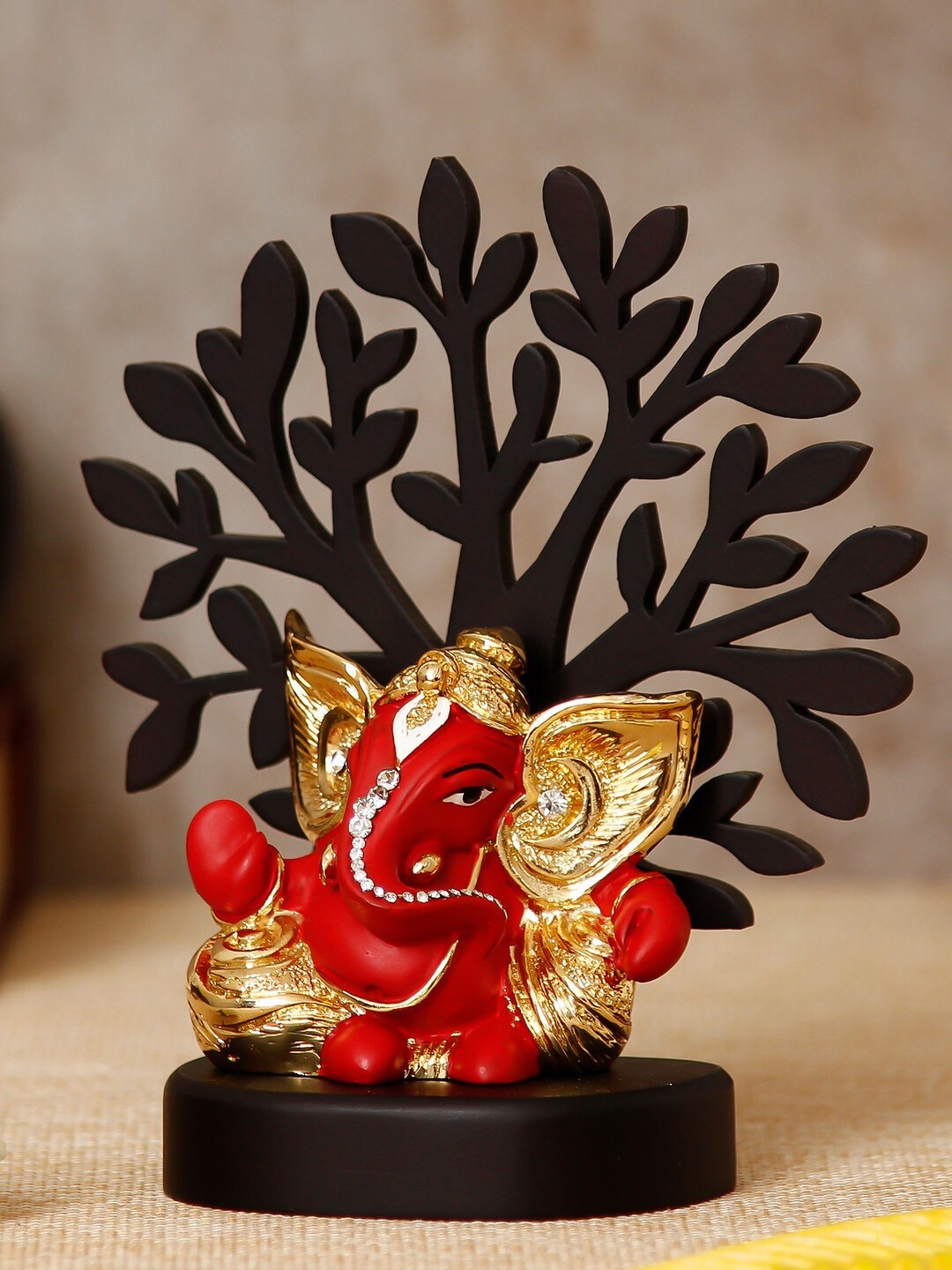 

eCraftIndia Gold-Plated Red & Black Wooden Base Handcrafted Kaan Ganesha Idol With Tree Showpiece