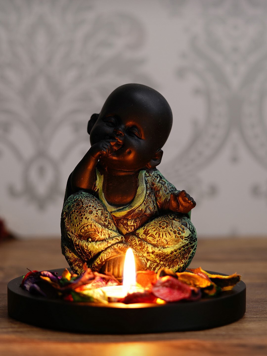 

eCraftIndia Green & Black Decorative Smiling Monk Buddha With Wooden Base Fragranced Petals & Tealight