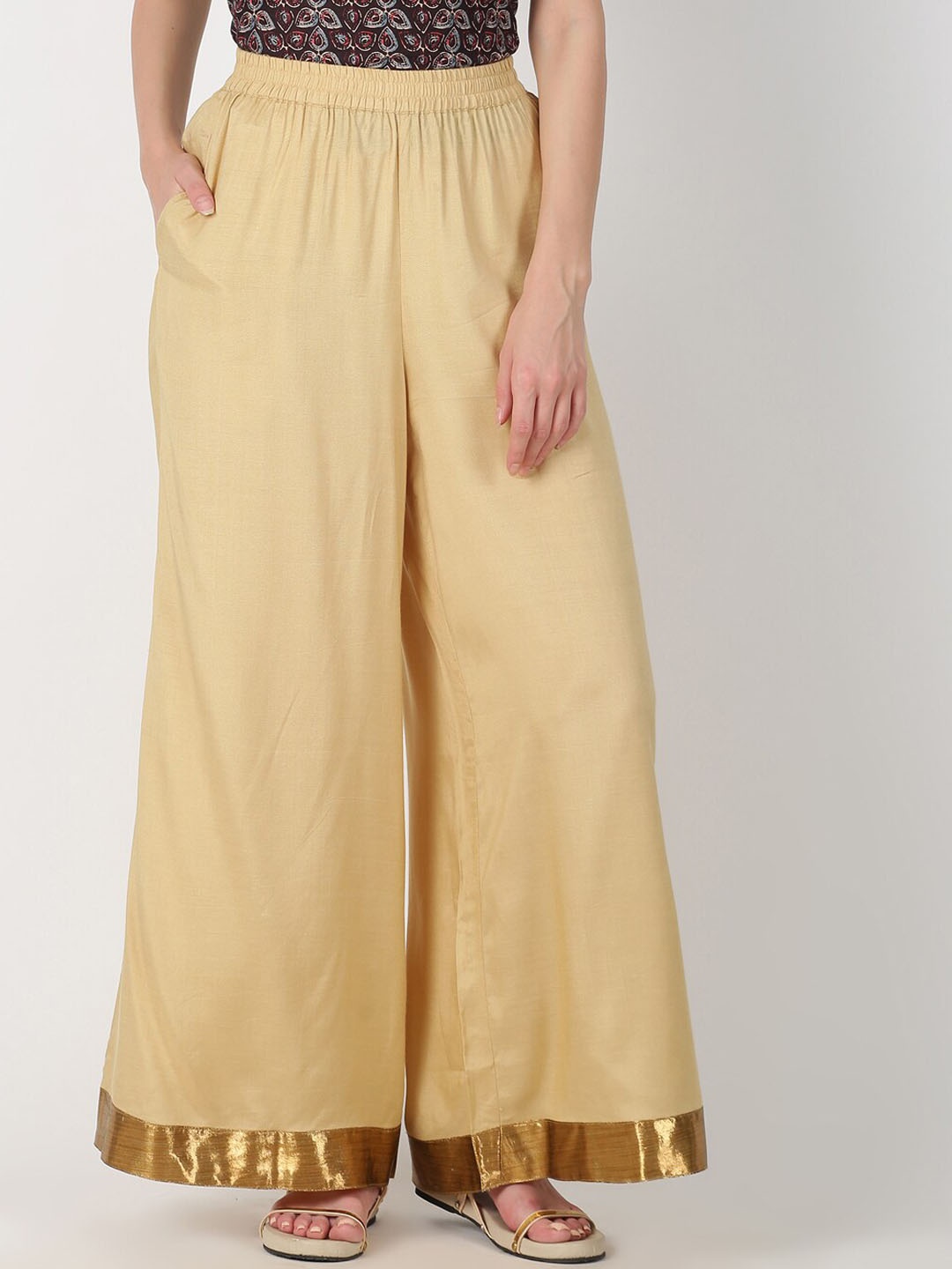 

Saffron Threads Women Gold-Toned Solid Straight Palazzos