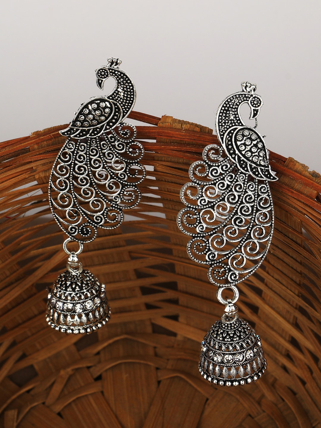 

ANIKAS CREATION Silver-Plated Peacock Shaped Jhumkas