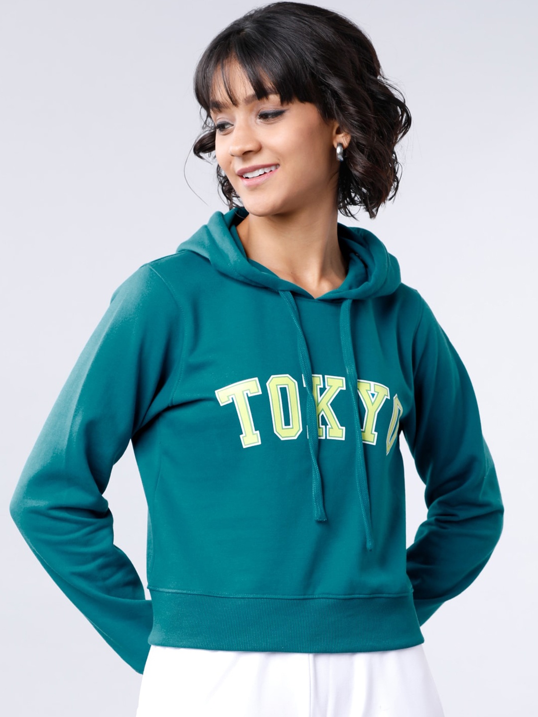 

Tokyo Talkies Women Teal Blue Printed Hooded Sweatshirt