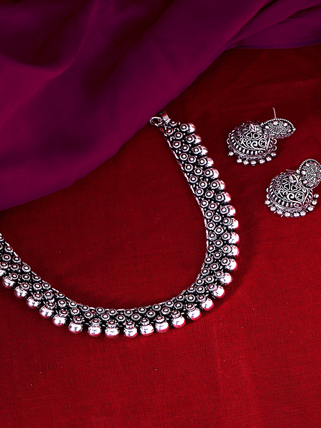 

Yellow Chimes Oxidized Silver-Plated & Off-White Kolhapuri Work Jewellery Set