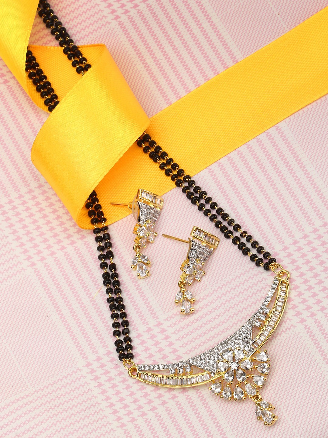 

Adwitiya Collection Gold-Plated Black Dual-Stranded Beaded Stone-Studded Mangalsutra & Earrings Set