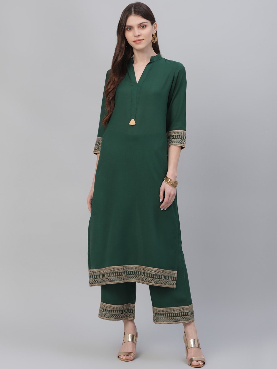 

Libas Women Green Solid Kurta with Trousers