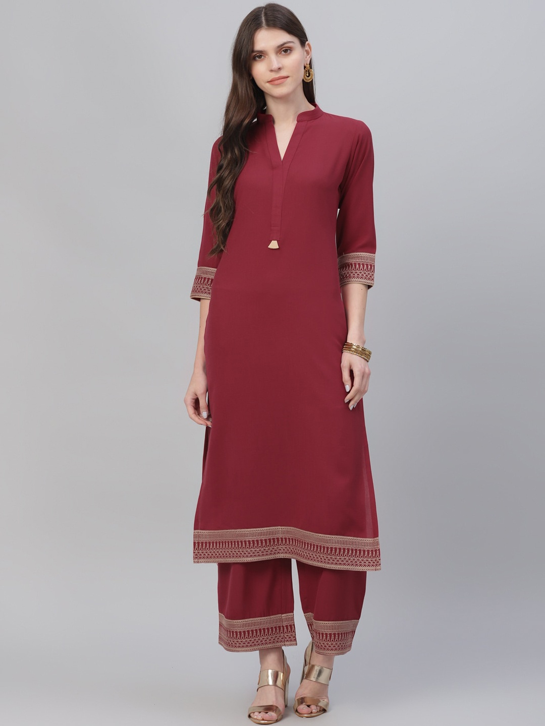 

Libas Women Maroon Solid Kurta with Palazzos