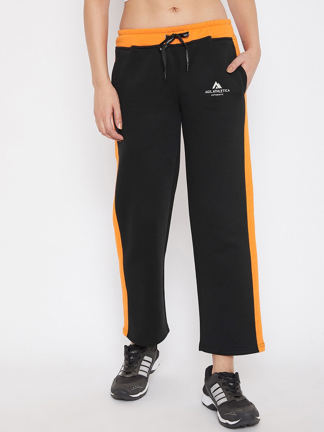 

AGIL ATHLETICA Women Black & Orange Solid Straight-Fit Track Pants