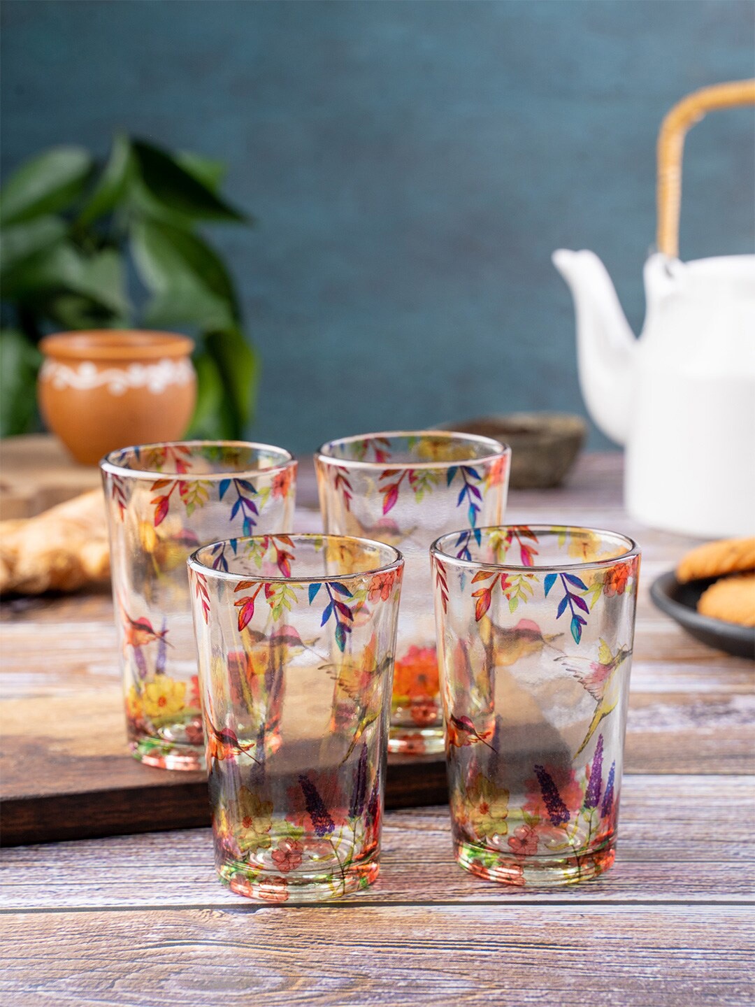 

Kolorobia Set Of 4 Transparent & Blue Humming Bird Printed Chai Glasses-200ML
