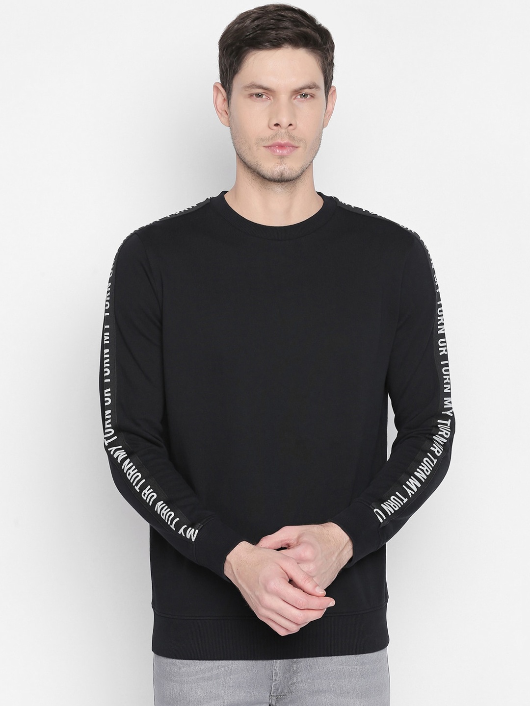 

Basics Men Black Solid Sweatshirt