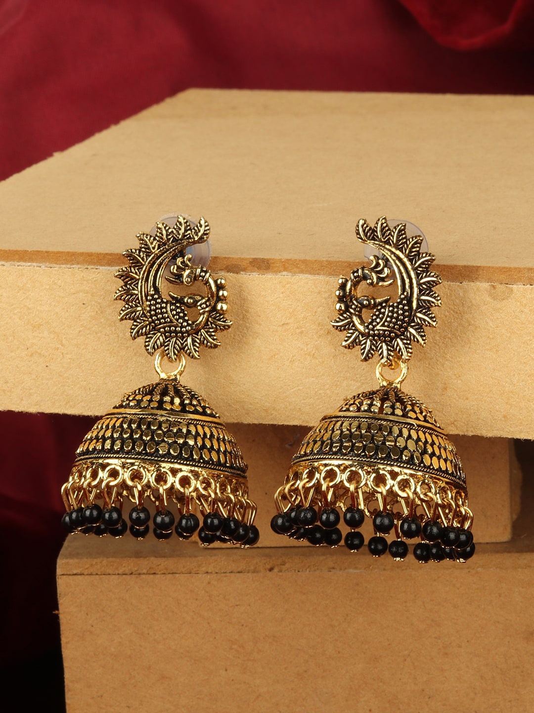 ANIKAS CREATION Gold-Plated & Black Dome Shaped Jhumkas