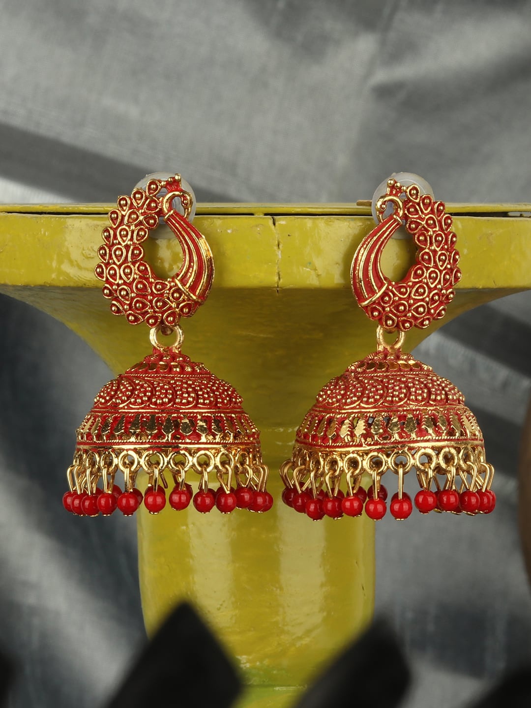 

ANIKAS CREATION Red & Gold-Plated Peacock Shaped Jhumkas