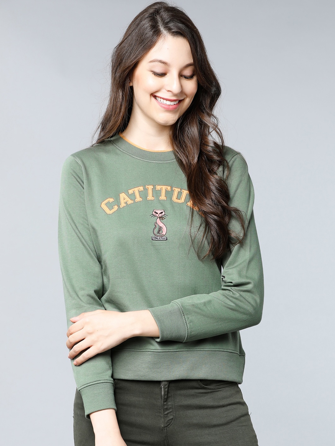 

Tokyo Talkies Women Green Solid Sweatshirt