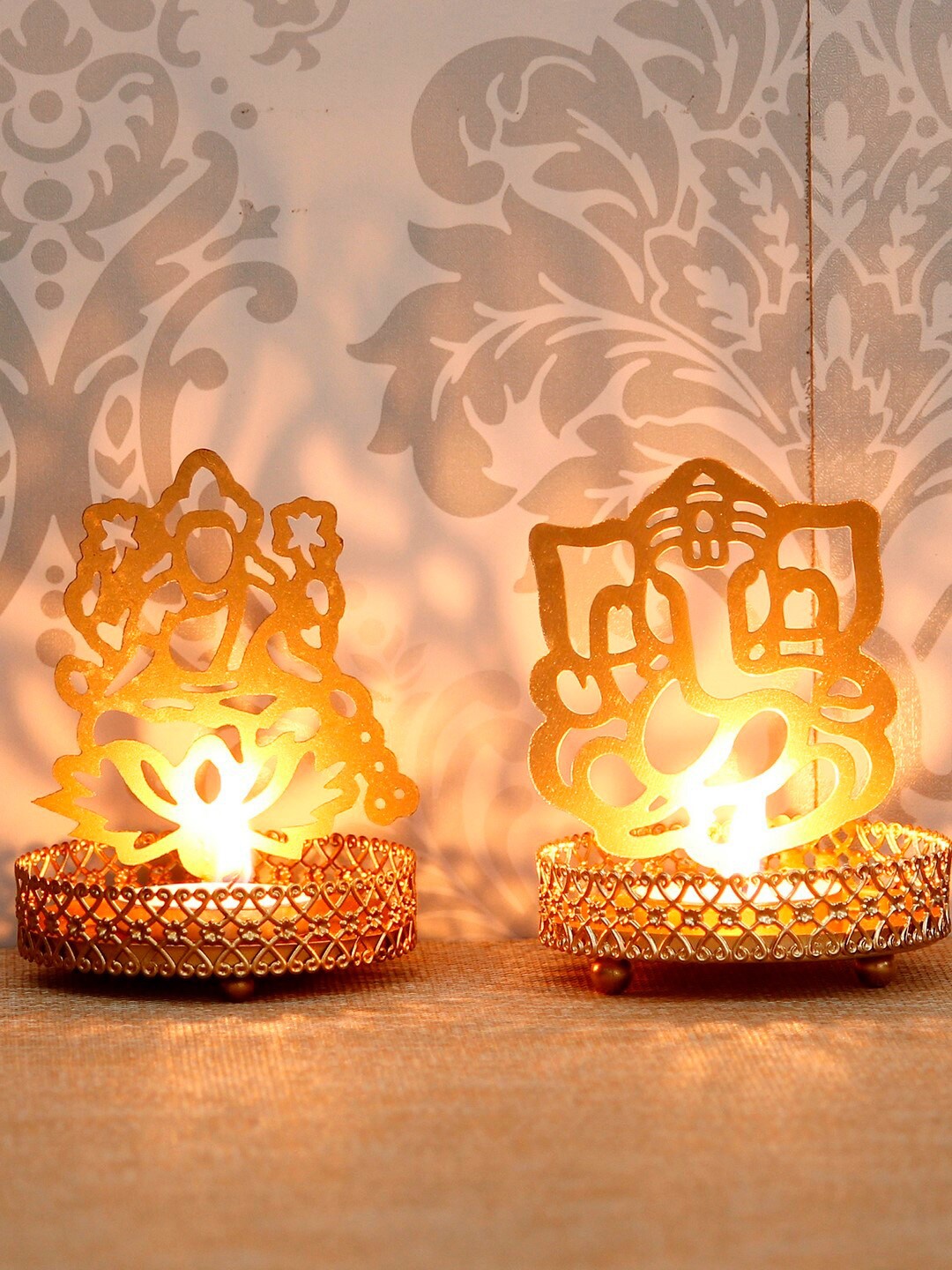 

eCraftIndia Set Of 2 Gold-Toned Handcrafted Lord Ganesha and Laxmi Tea Light Holder