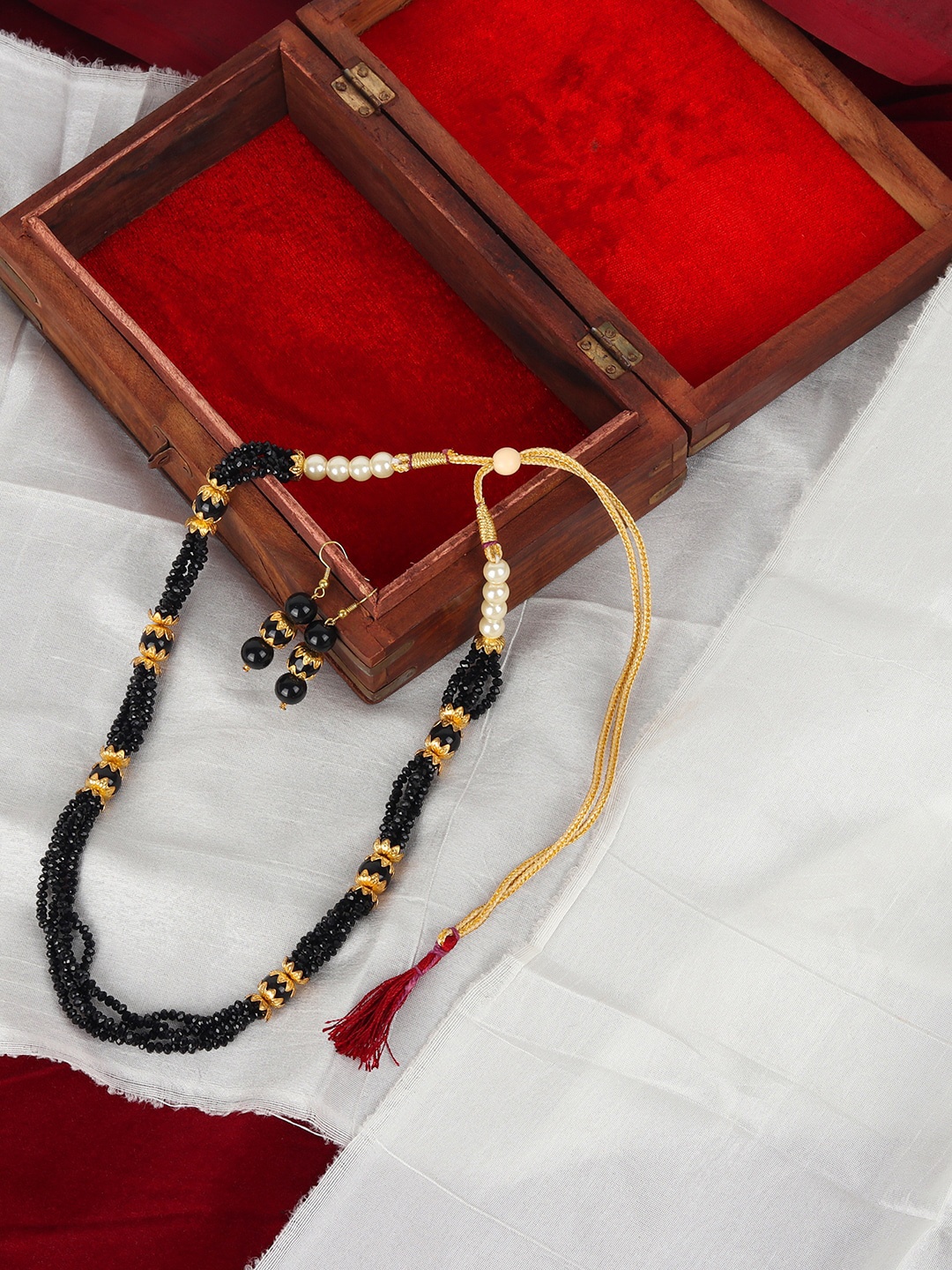 ANIKAS CREATION Gold-Plated Black Beaded Multi-Stranded Handcrafted Jewellery Set