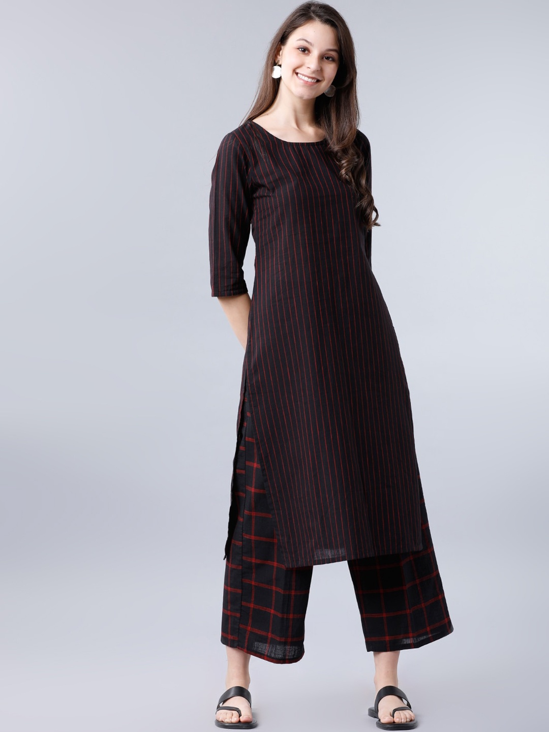 

Vishudh Women Black Striped Kurta with Palazzos