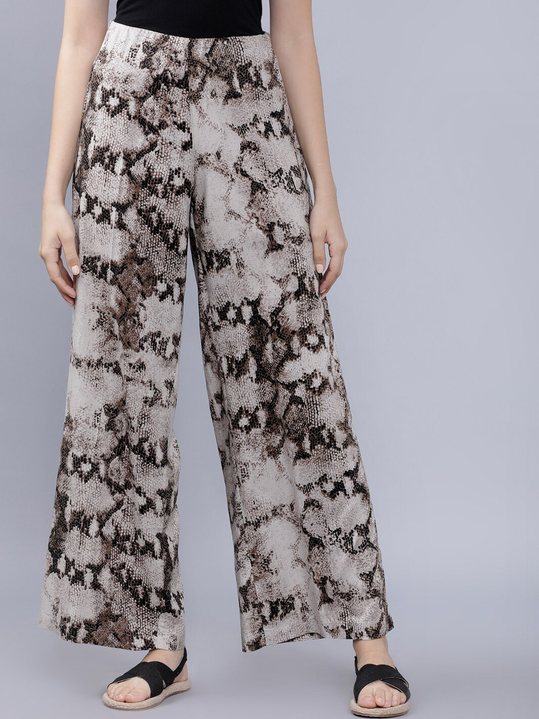 

Tokyo Talkies Women Brown & Black Loose Fit Animal Printed Parallel Trousers