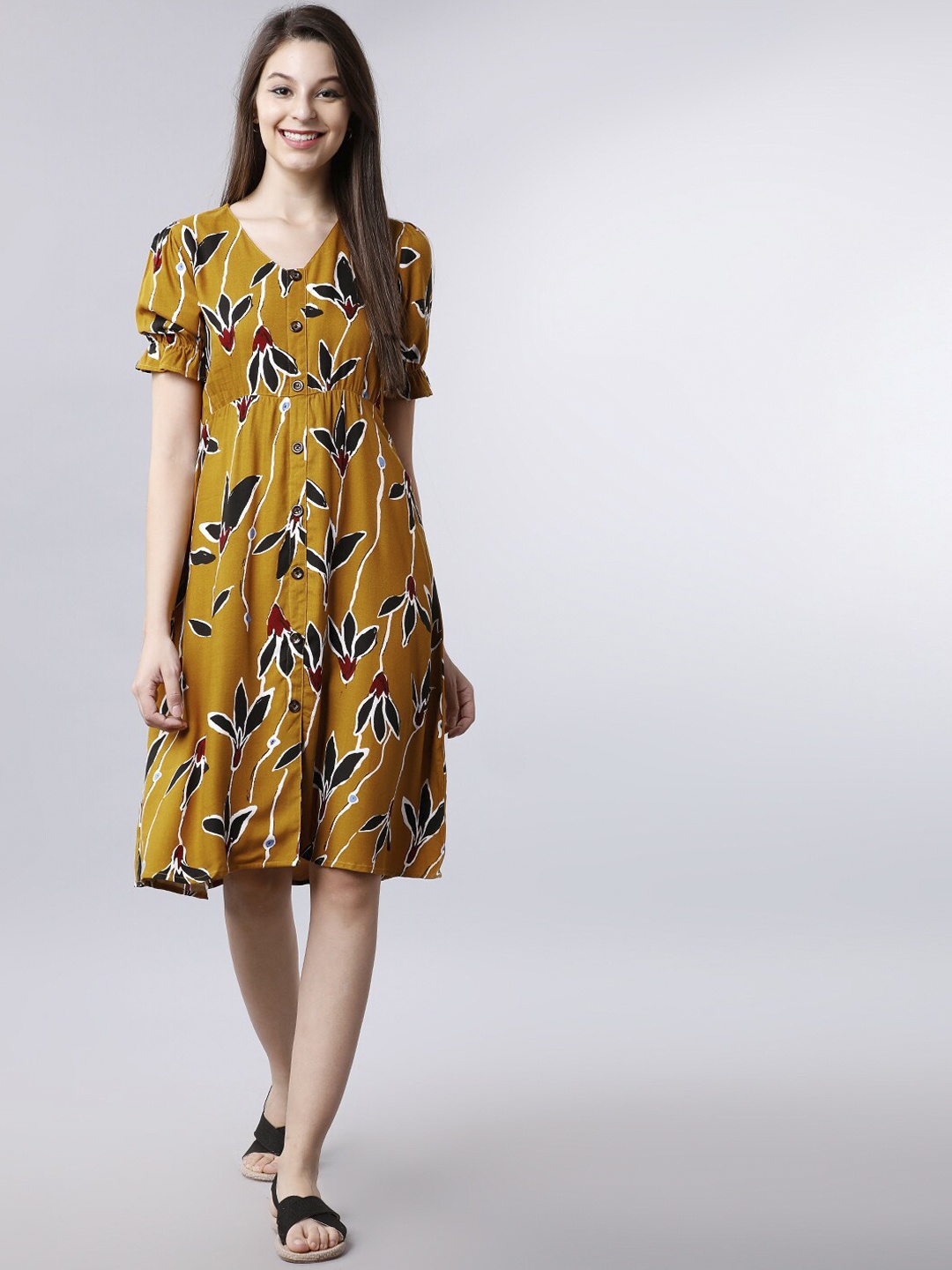 

Tokyo Talkies Women Yellow Printed Fit and Flare Dress