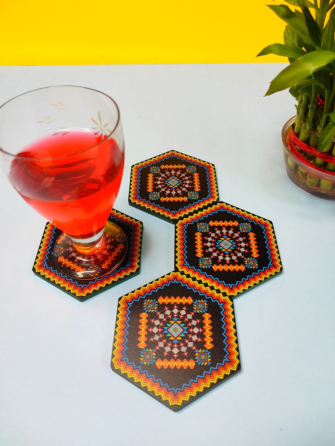 

CRAYTON Set Of 4 Black & Orange Geometric Print Hexagon Wooden Coasters