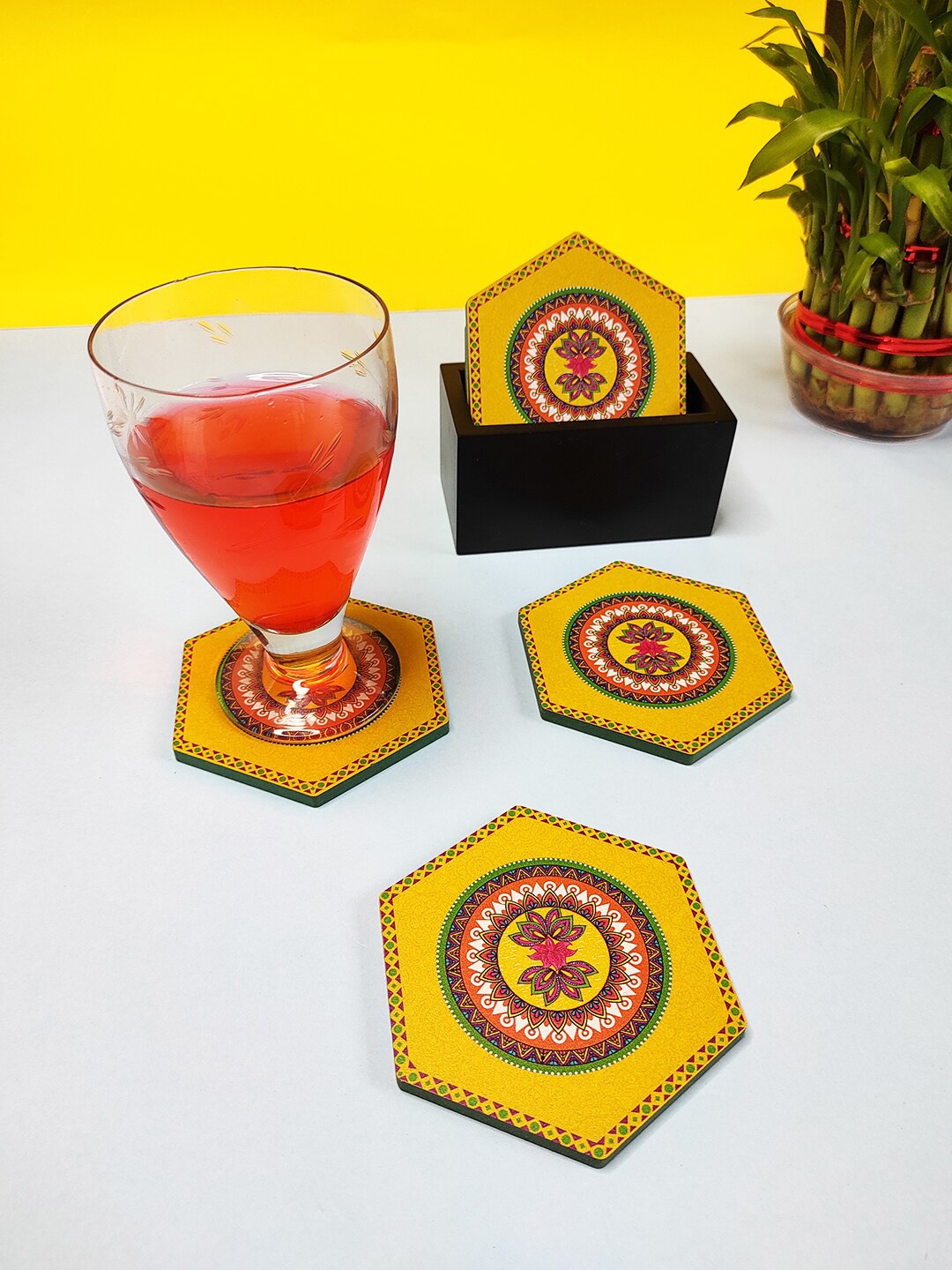 

CRAYTON Set Of 6 Yellow & Red Madhubani Print Hexagon Wooden Coasters With Holder