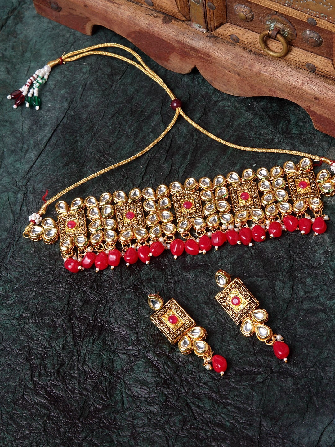 

Shining Diva Women Gold-Plated White & Red Kundan Studded Antique Jewellery Set