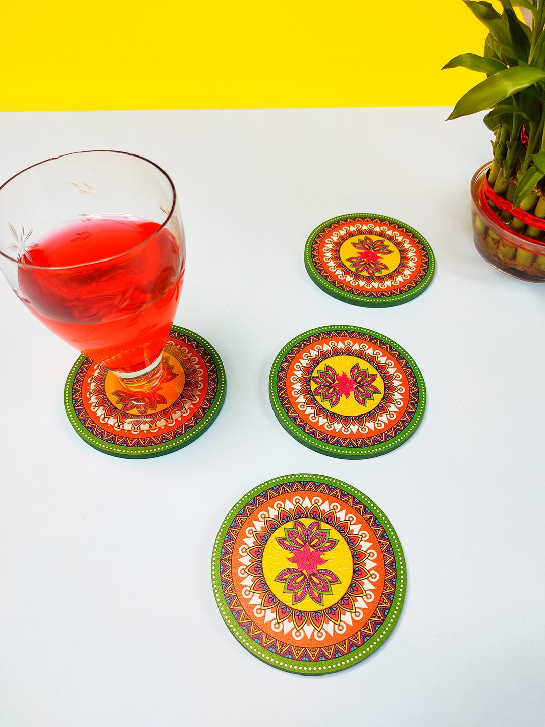 

CRAYTON Set Of 4 Yellow & Red Madhubani Print Round Wooden Coasters