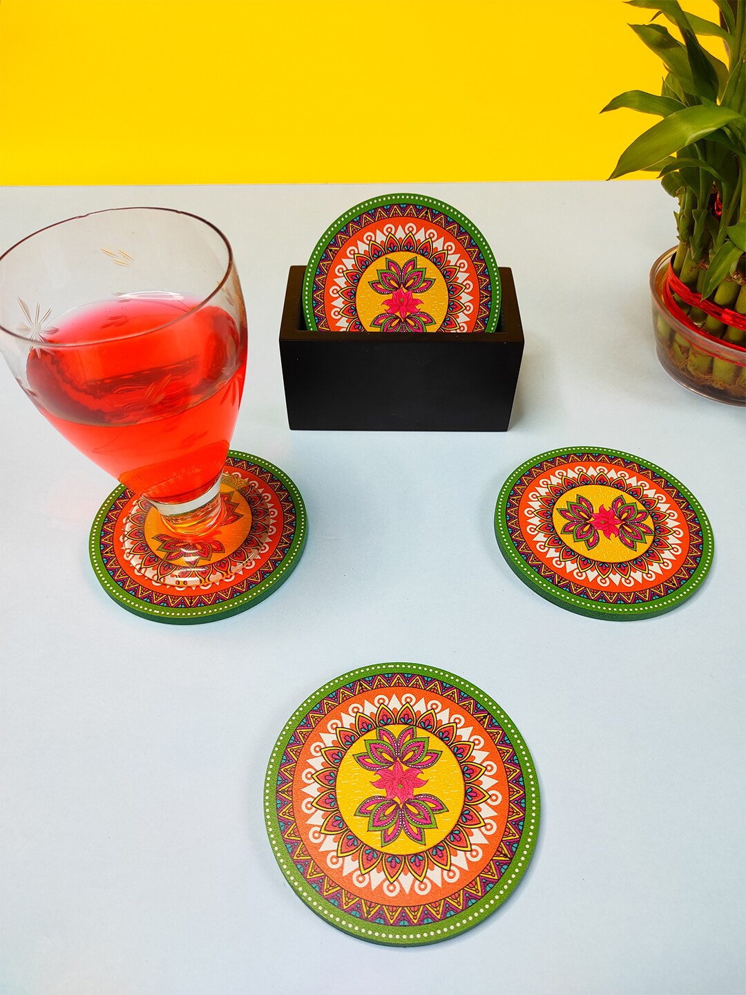 

CRAYTON Set Of 6 Yellow & Green Madhubani Print Round Wooden Coasters With Holder