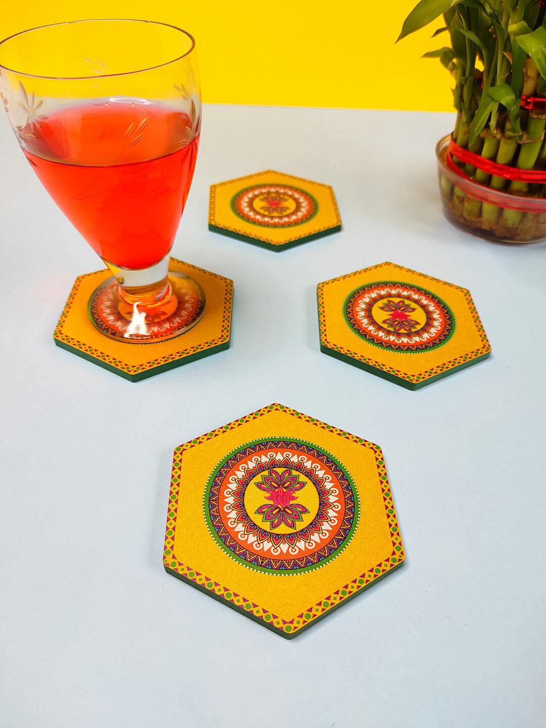 

CRAYTON Set Of 4 Yellow & Green Madhubani Print Hexagon Wooden Coasters